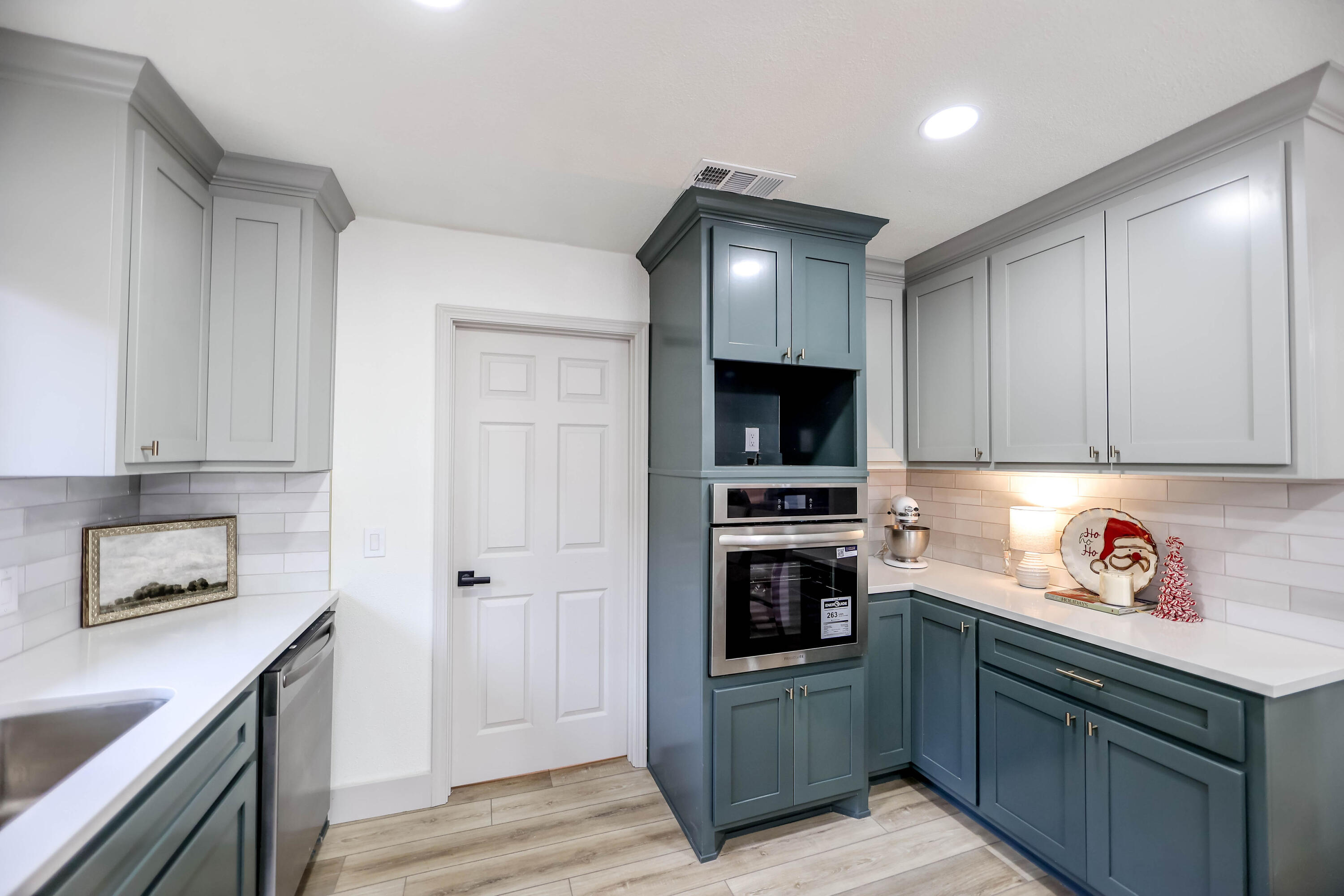 4411 79th Street Lubbock, TX 79424 - Photo 13 of 42 a kitchen with stainless steel appliances a stove microwave and refrigerator