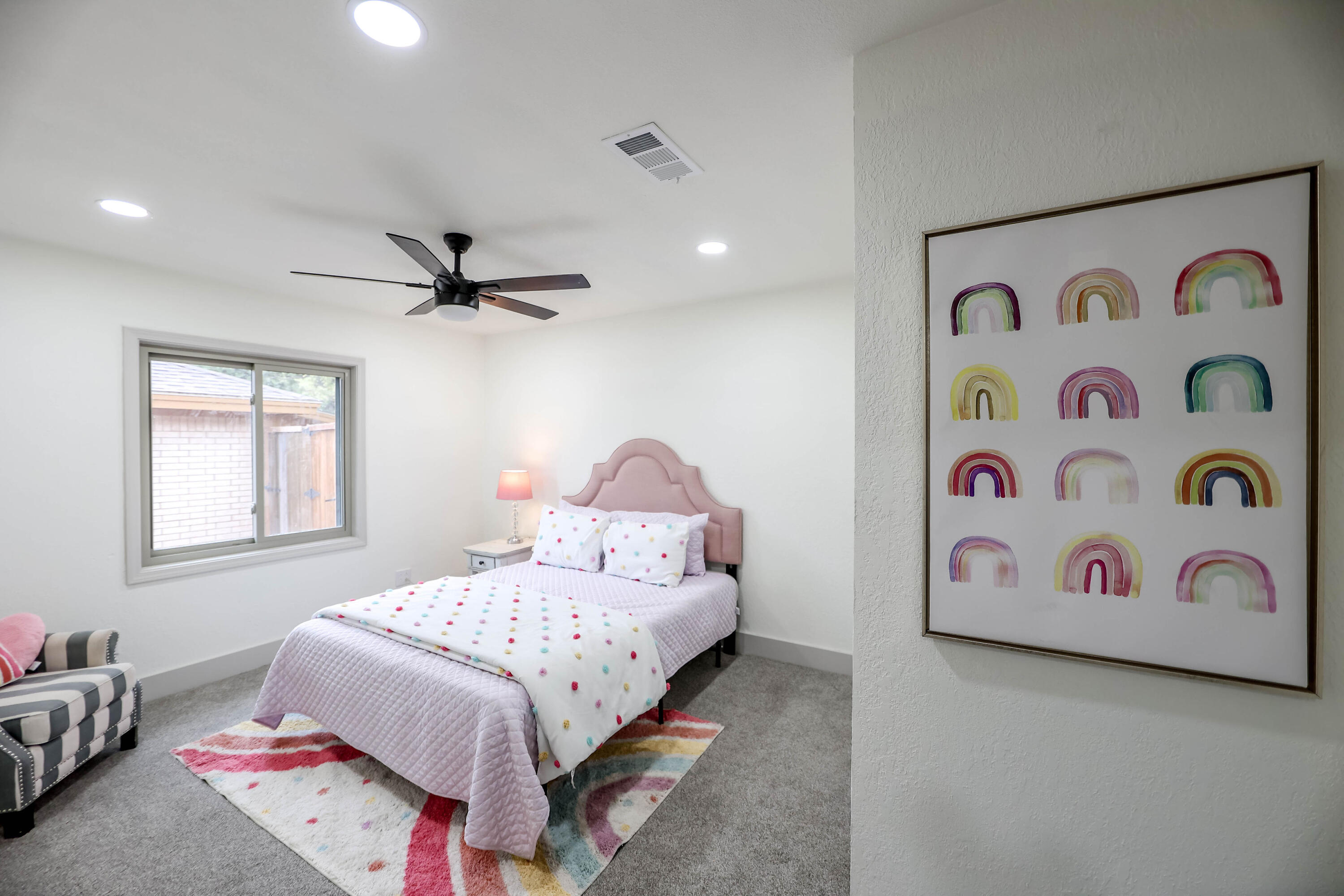 4411 79th Street Lubbock, TX 79424 - Photo 21 of 42 a bedroom with a bed and a painting on the wall