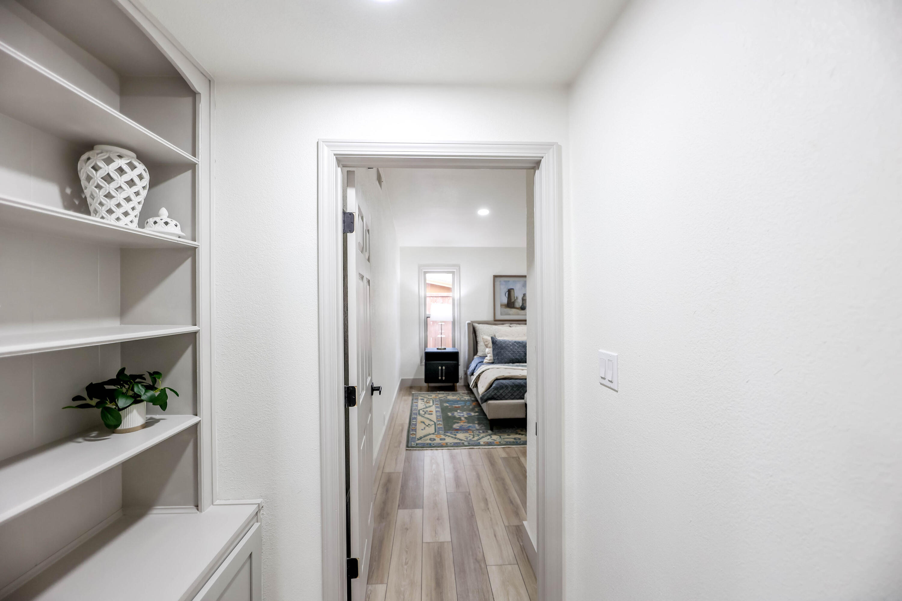 4411 79th Street Lubbock, TX 79424 - Photo 26 of 42 a view of a bedroom from a hallway