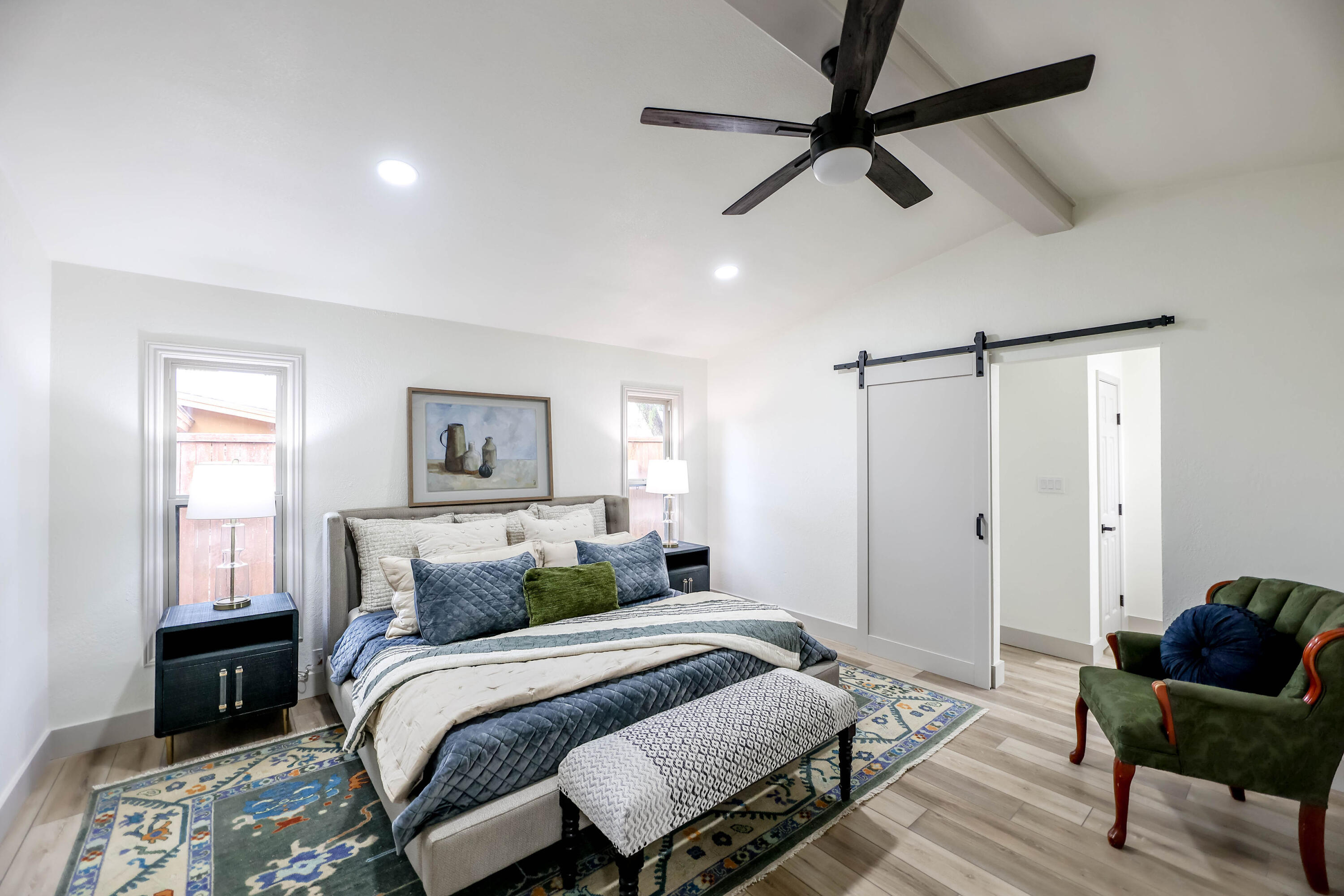 4411 79th Street Lubbock, TX 79424 - Photo 27 of 42 a bedroom with a bed and wooden floor