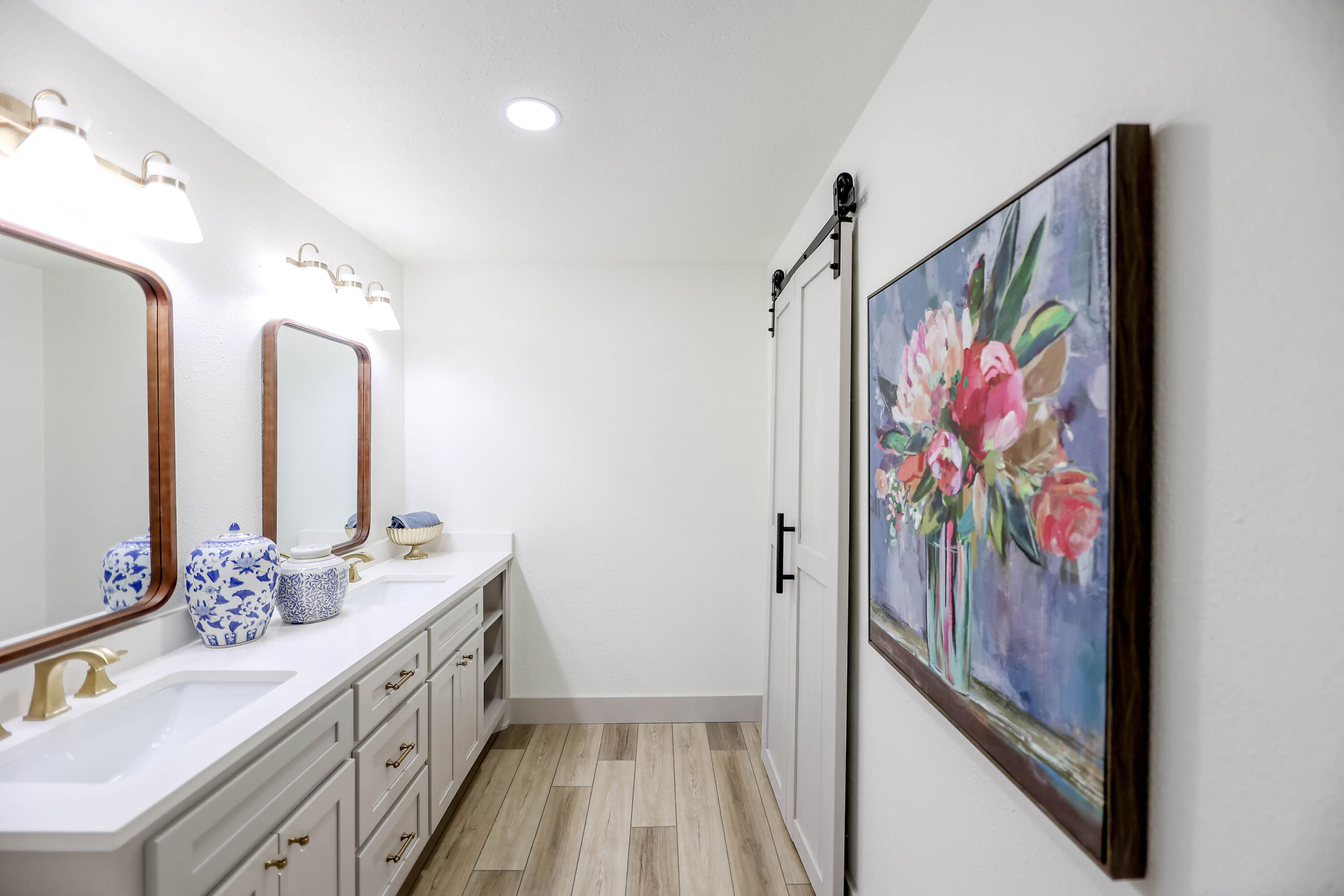 4411 79th Street Lubbock, TX 79424 - Photo 28 of 42 a bathroom with a double vanity sink and a mirror