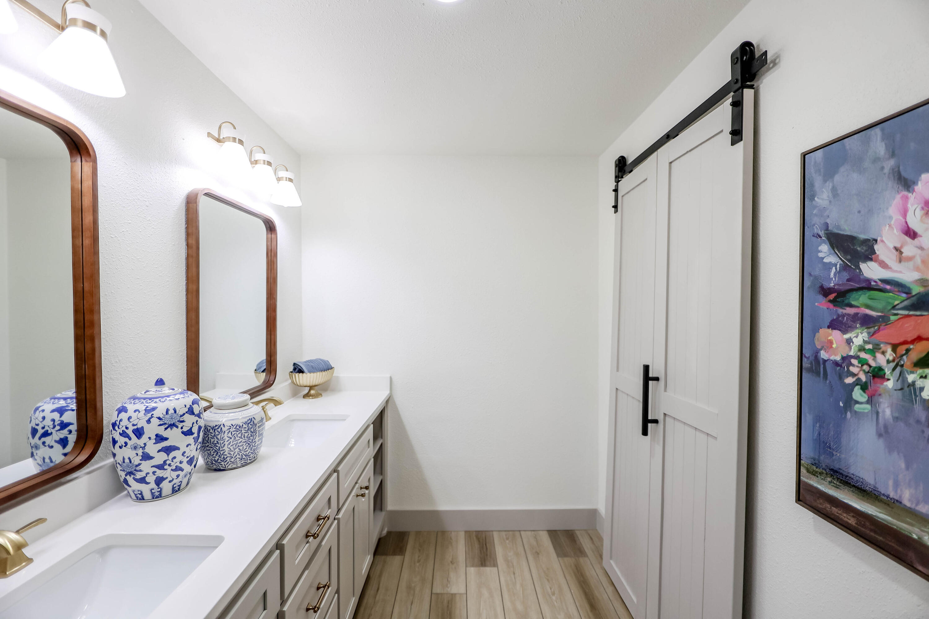 4411 79th Street Lubbock, TX 79424 - Photo 29 of 42 a bathroom with double vanity sink and a mirror