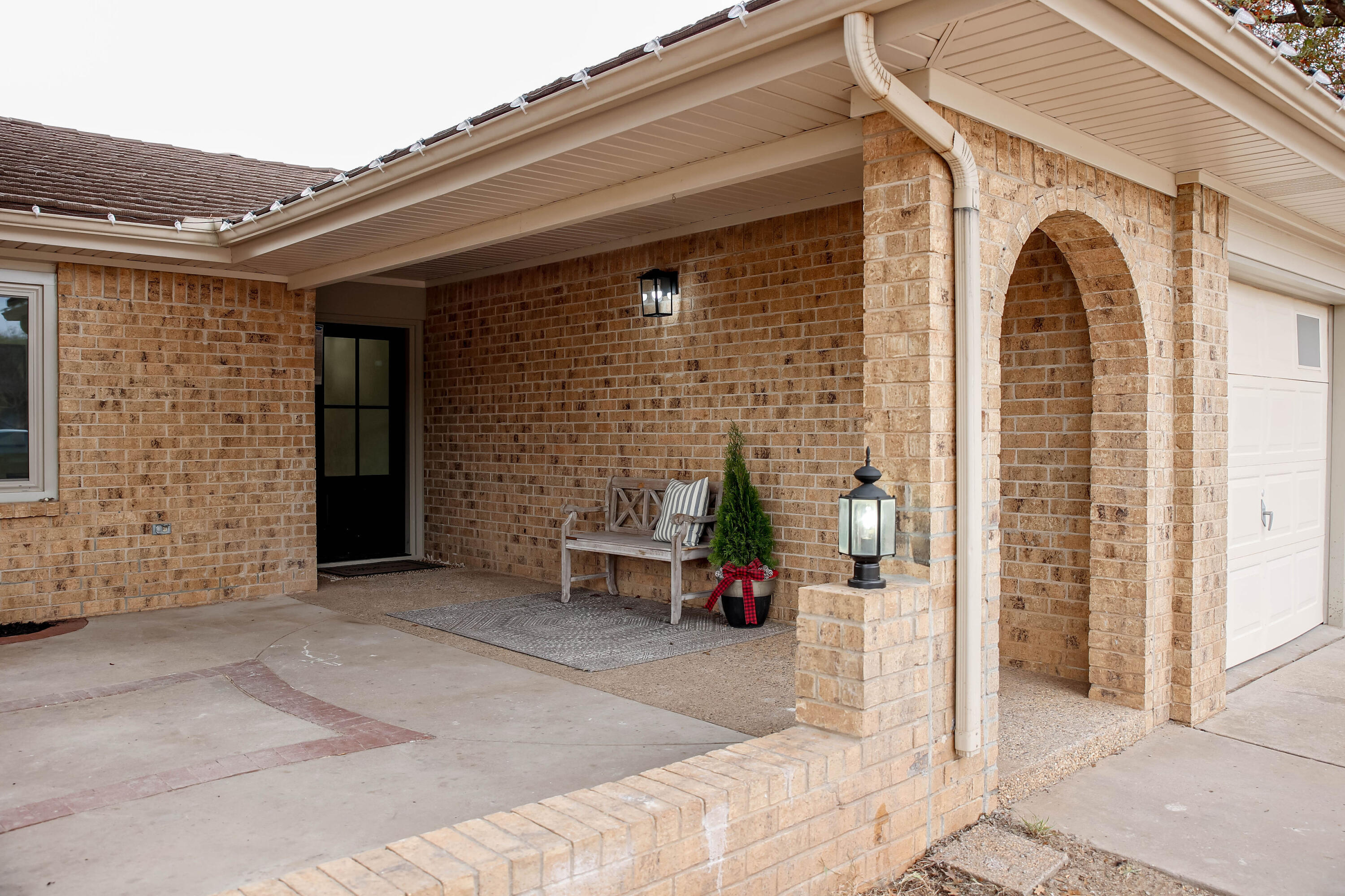 4411 79th Street Lubbock, TX 79424 - Photo 3 of 42 a view of a patio with a table and chairs and potted plants