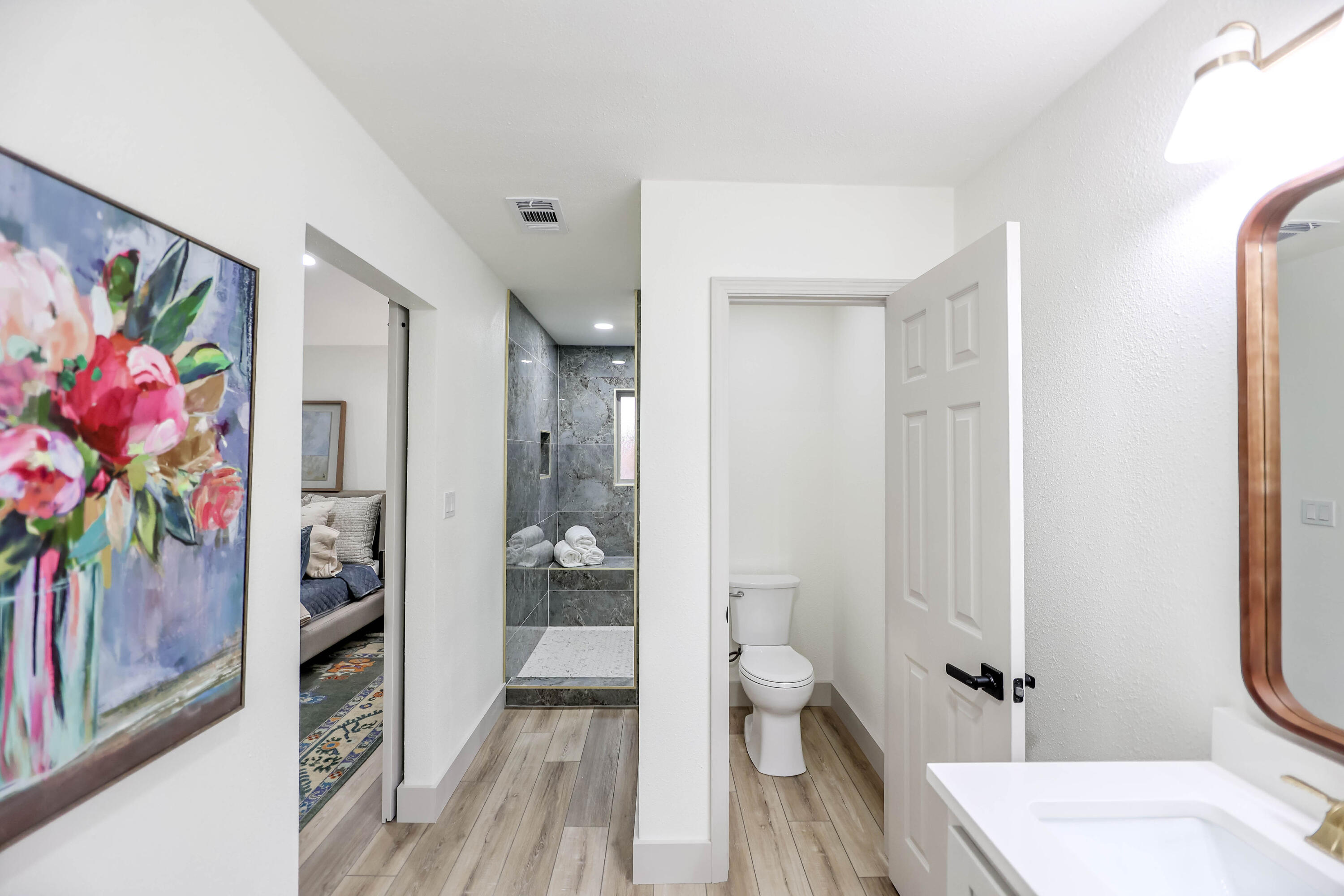 4411 79th Street Lubbock, TX 79424 - Photo 31 of 42 a bathroom with a sink a toilet and shower