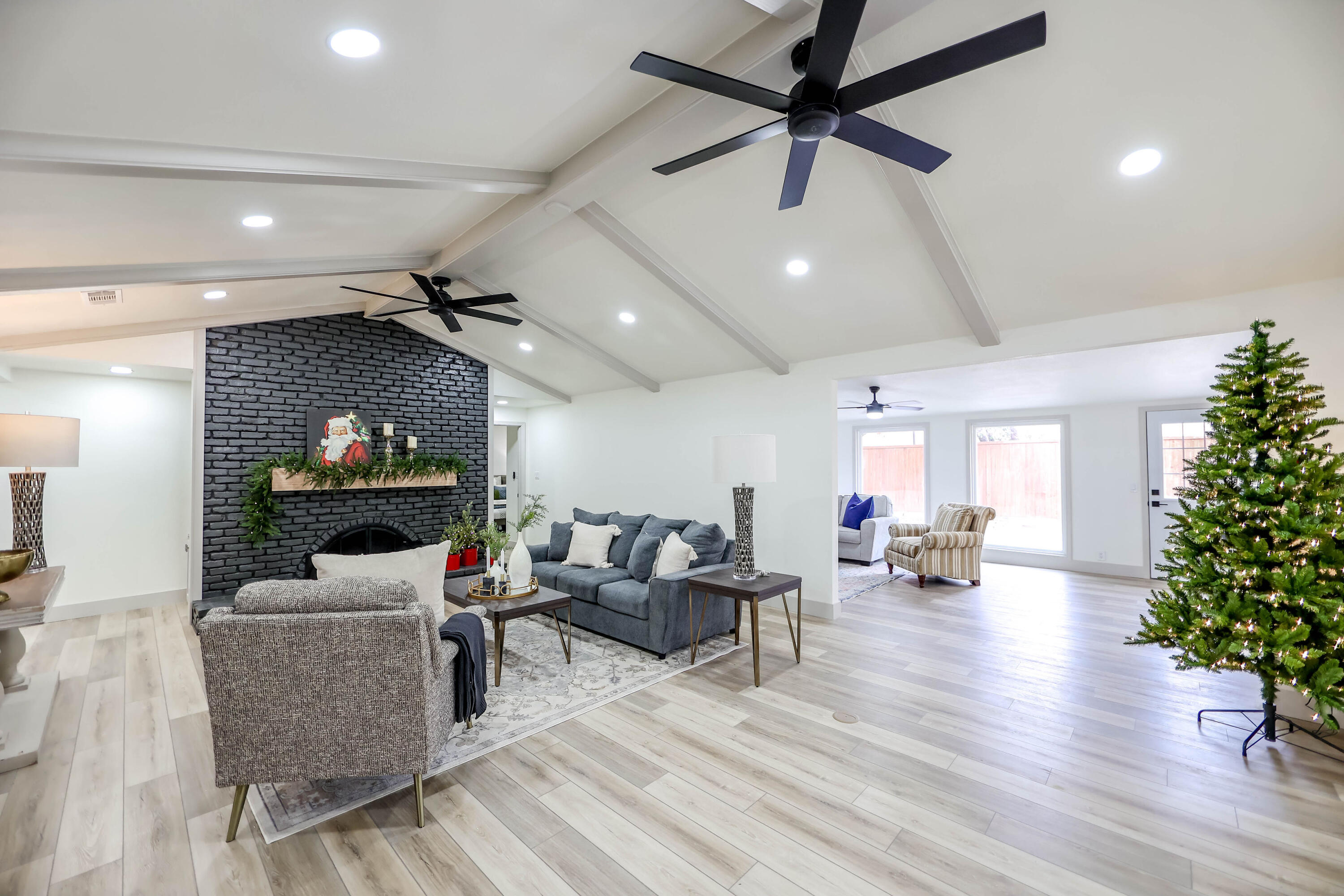 4411 79th Street Lubbock, TX 79424 - Photo 5 of 42 a living room with furniture and a flat screen tv