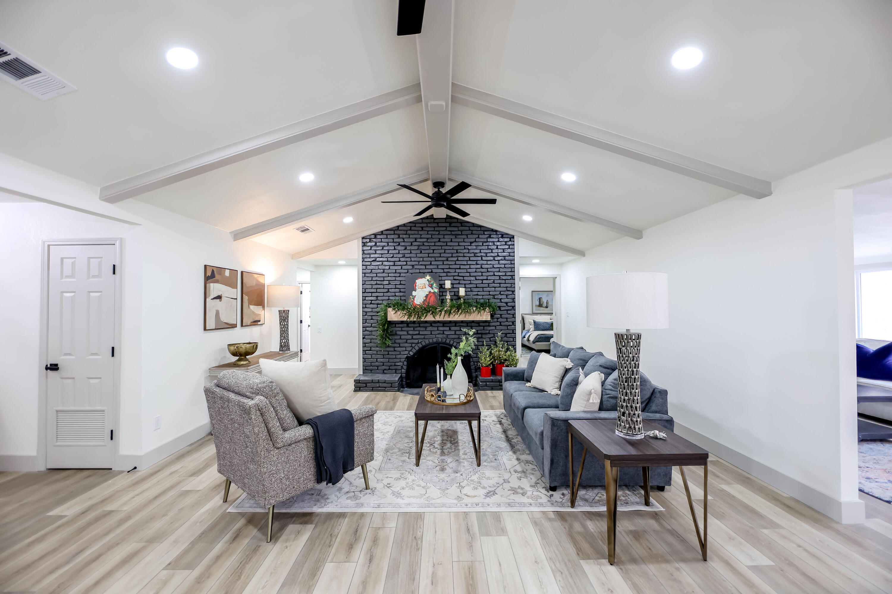 4411 79th Street Lubbock, TX 79424 - Photo 6 of 42 a living room with furniture and a fireplace