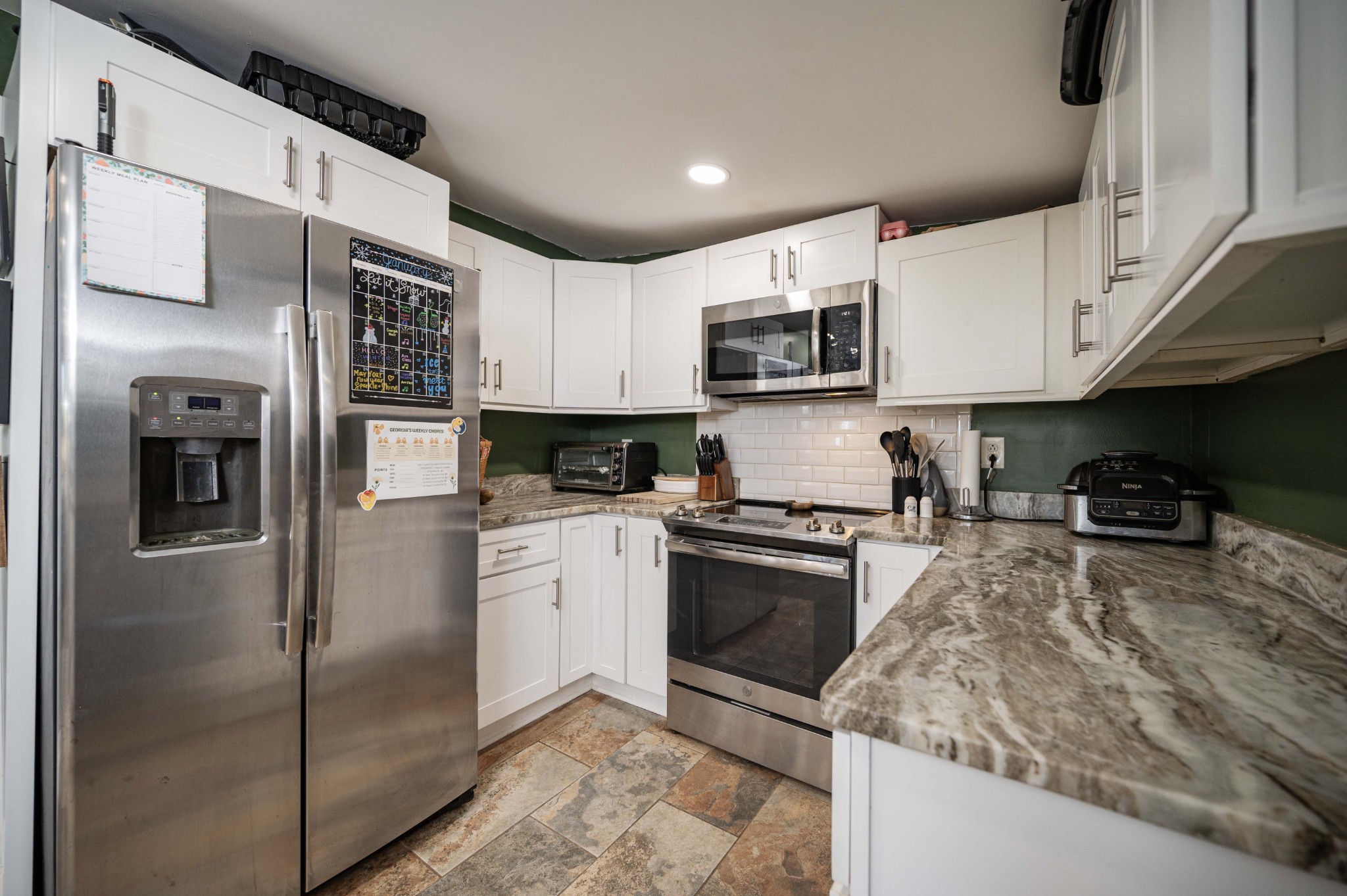 9202 Link Road Christiana, TN 37037 - Photo 14 of 37 a kitchen with stainless steel appliances granite countertop a refrigerator a stove top oven a sink and dishwasher