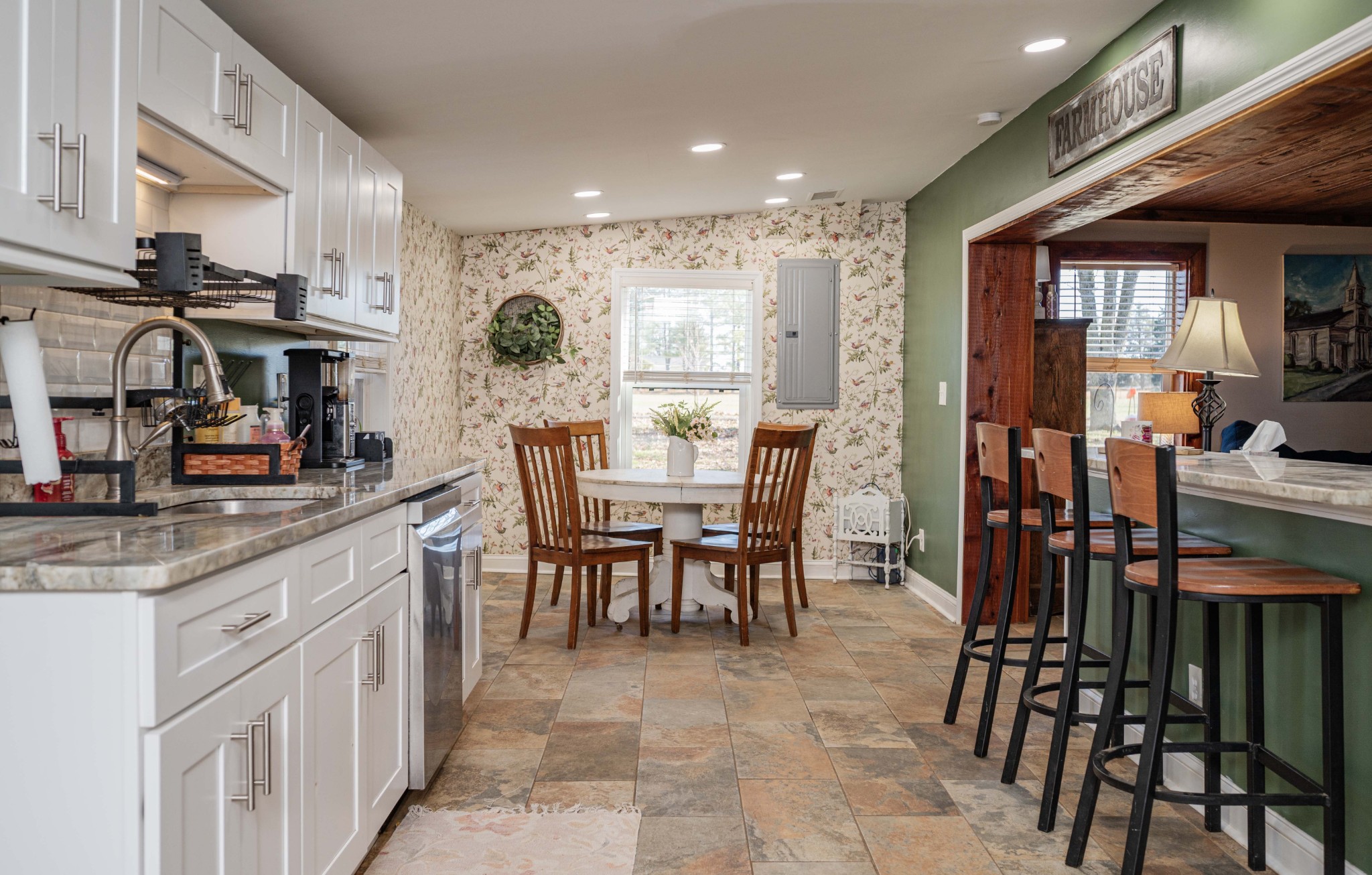 9202 Link Road Christiana, TN 37037 - Photo 15 of 37 a kitchen with stainless steel appliances granite countertop table chairs sink and cabinets