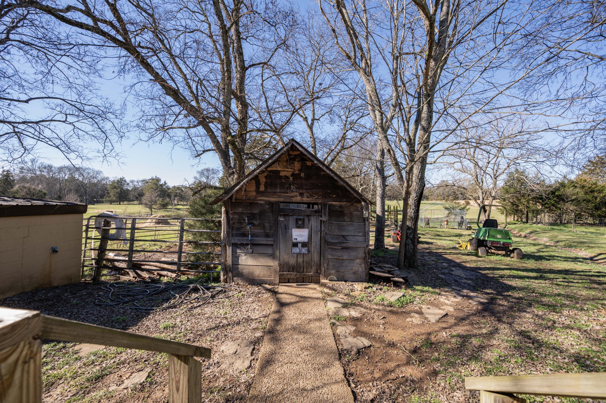 9202 Link Road Christiana, TN 37037 - Photo 32 of 37 a front view of a house with a yard covered with snow and trees