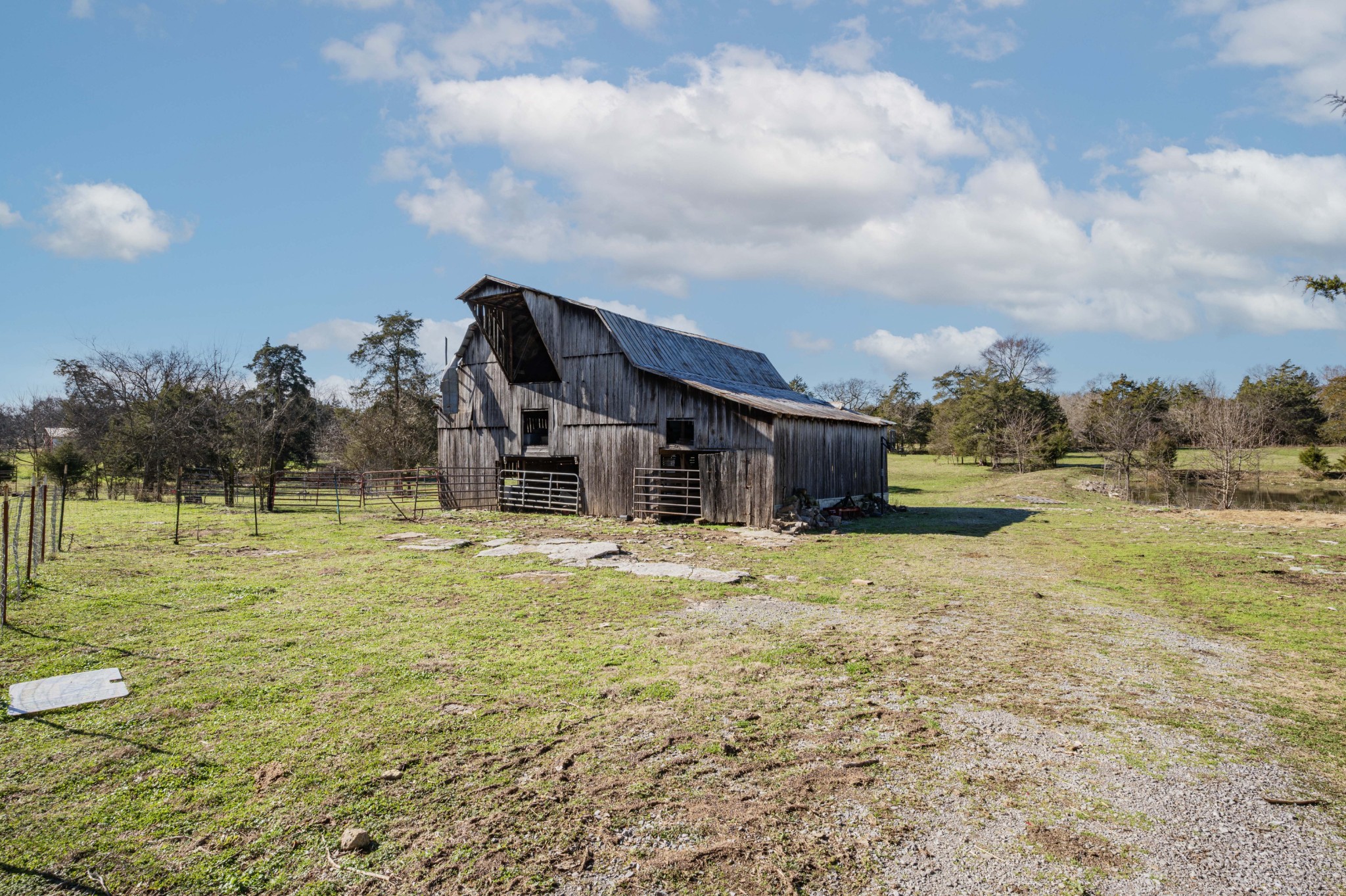 9202 Link Road Christiana, TN 37037 - Photo 37 of 37 a view of a big house with a big yard and large trees
