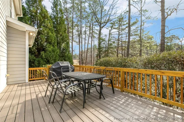 a view of balcony with furniture and wooden floor