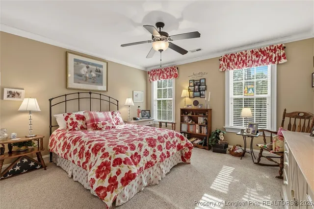 a bedroom with a bed couch and a window