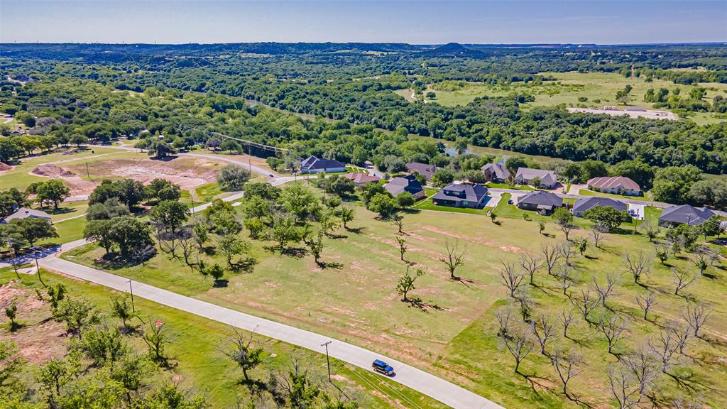 8433 West Landings Road Granbury, TX 76049 - Photo 12 of 24 a view of a lake with a mountain