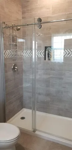 a bathroom with a shower and bathtub