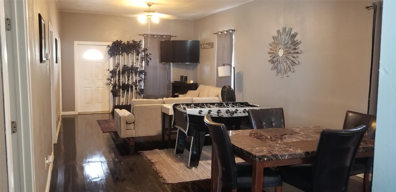 407 South Main Street Taylor, TX 76574 - Photo 12 of 15 a view of a dining room with furniture and wooden floor