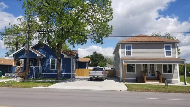 a front view of a house with a yard table and chairs