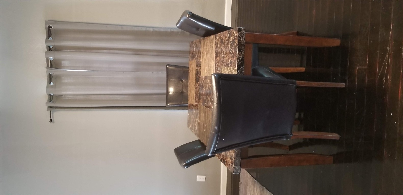 407 South Main Street Taylor, TX 76574 - Photo 5 of 15 a view of a dining room with furniture and wooden floor