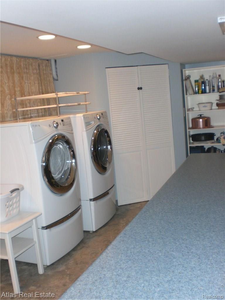 8042 Burleigh Road Grand Blanc, MI 48439 - Photo 31 of 57 Large Inviting Laundry Room with extra long built in folding table