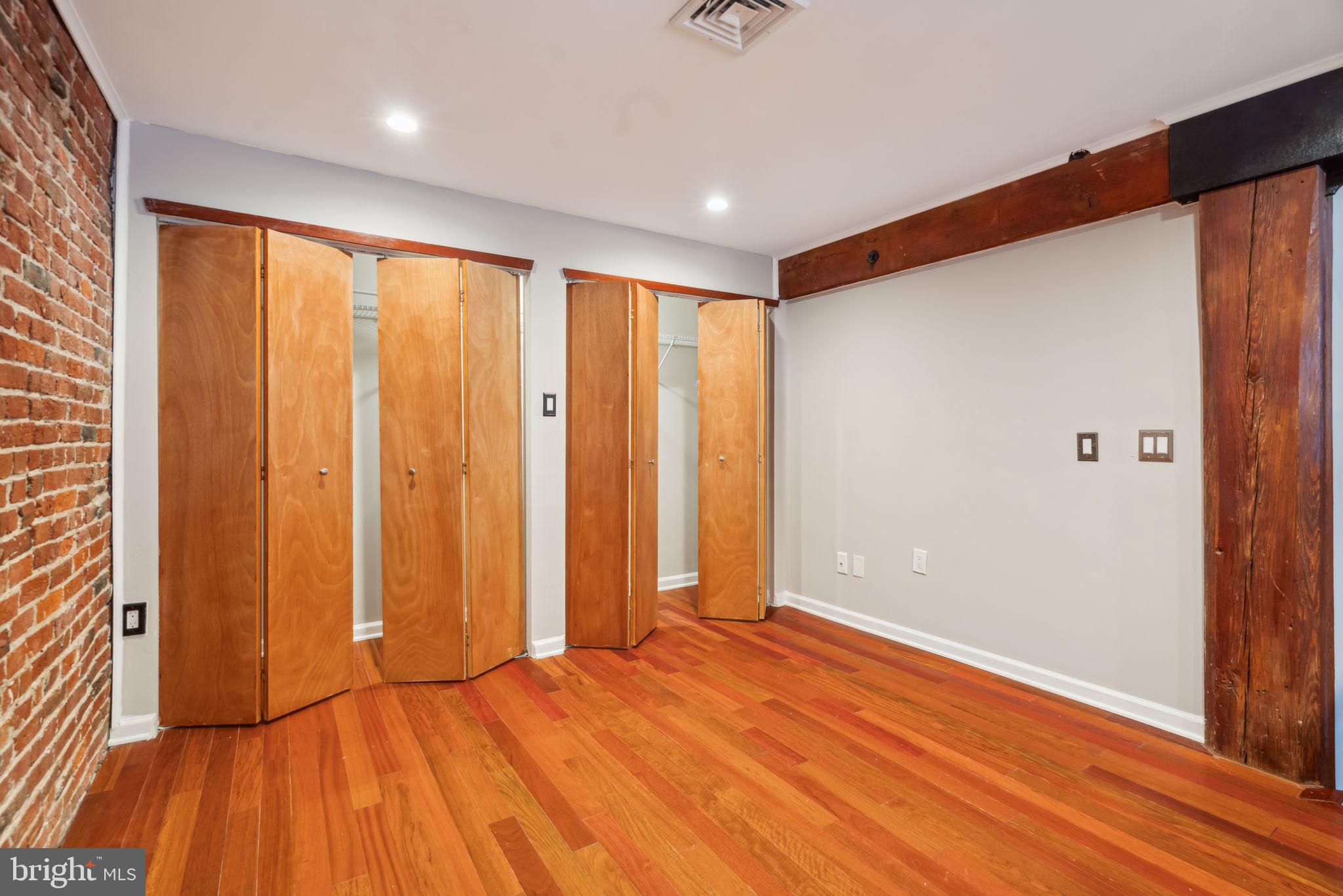 12 Letitia Street, Unit 201 Philadelphia, PA 19106 - Photo 20 of 30 a view of an empty room with wooden floor and a window