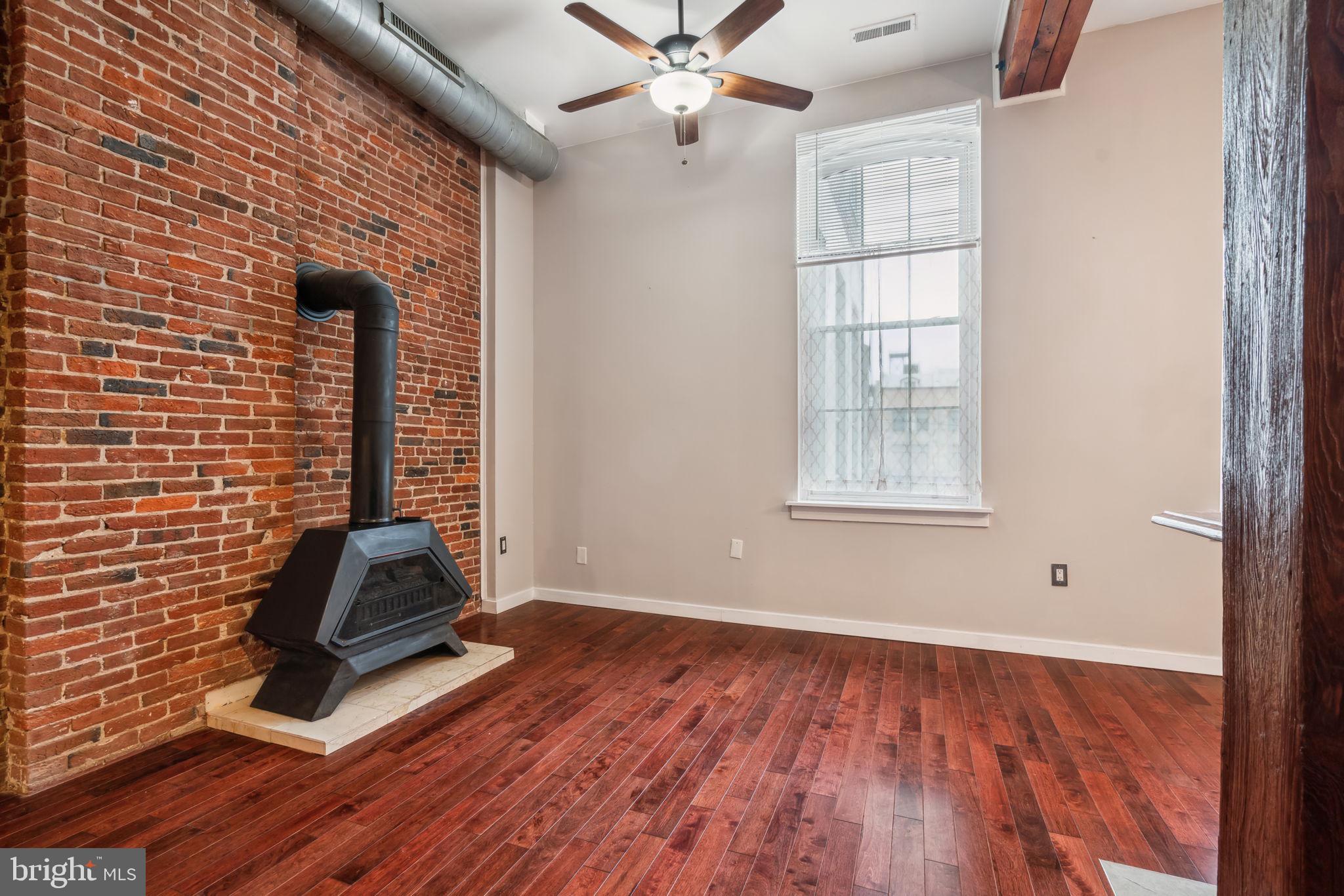 12 Letitia Street, Unit 201 Philadelphia, PA 19106 - Photo 4 of 30 an empty room with wooden floor fan and windows