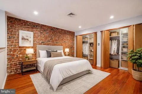 a bedroom with a large bed and furniture