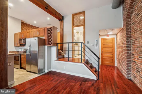 a view of entryway with wooden floor