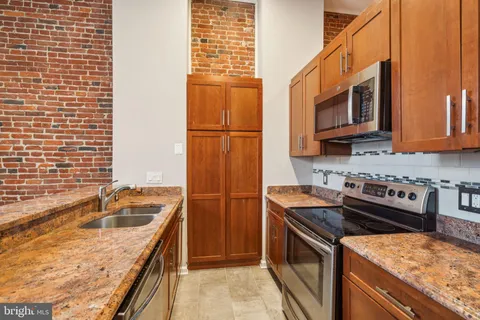 a view of kitchen with wooden floor