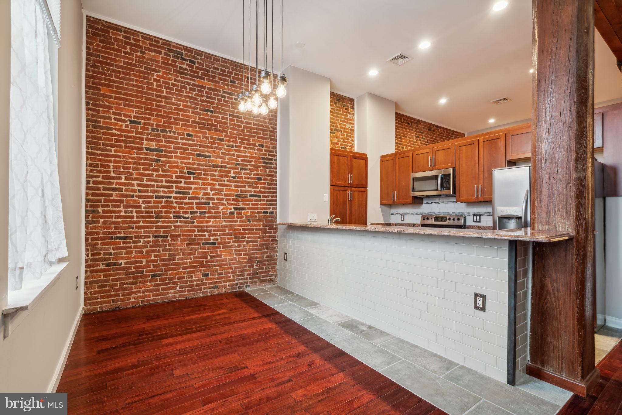 12 Letitia Street, Unit 201 Philadelphia, PA 19106 - Photo 7 of 30 a view of kitchen with wooden floor
