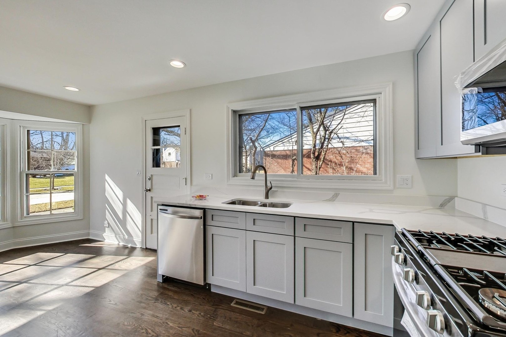 1835 Smith Road Northbrook, IL 60062 - Photo 13 of 54 a kitchen with a sink stove and cabinets