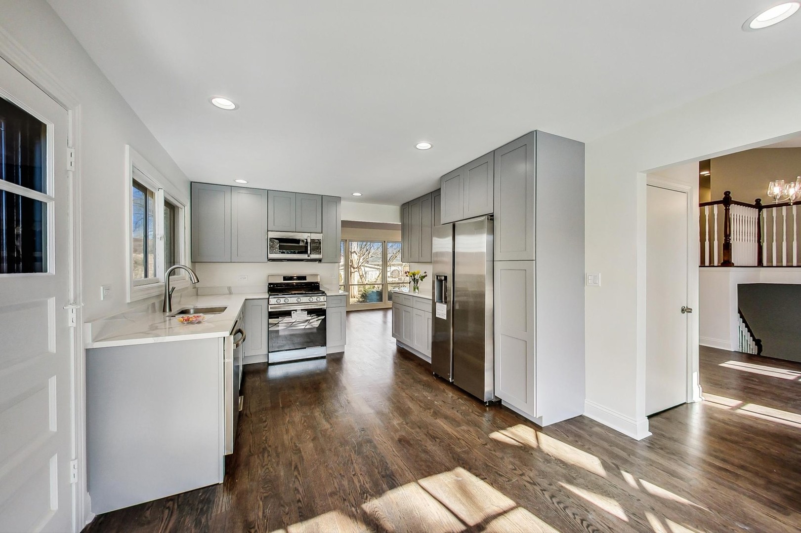 1835 Smith Road Northbrook, IL 60062 - Photo 14 of 54 a open kitchen with white cabinets and stainless steel appliances