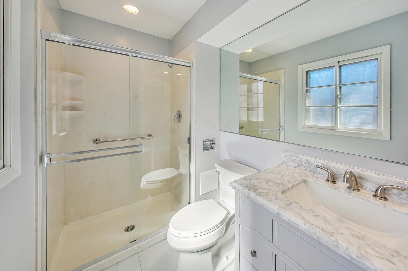 1835 Smith Road Northbrook, IL 60062 - Photo 26 of 54 a bathroom with a granite countertop sink toilet and shower