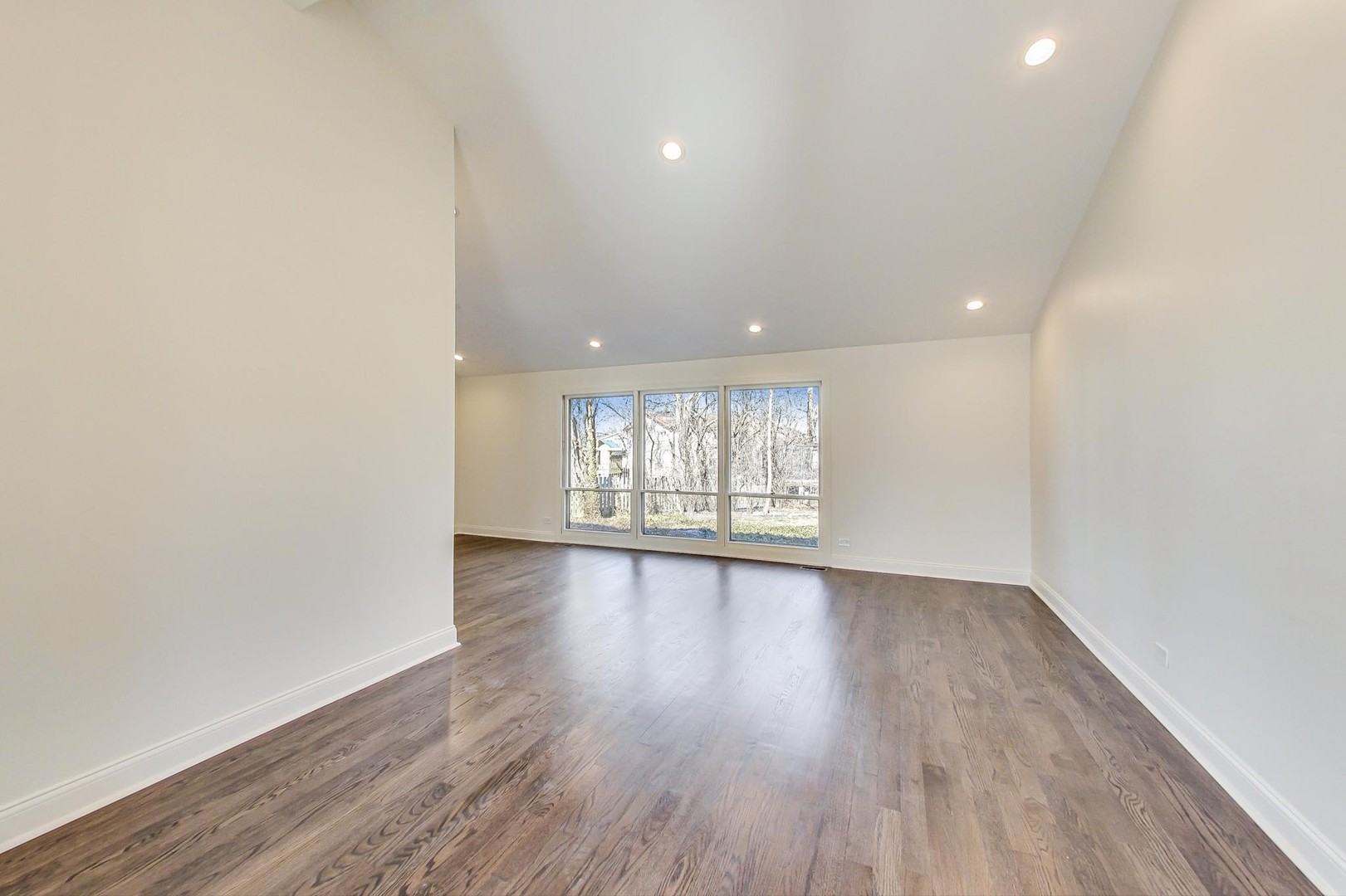1835 Smith Road Northbrook, IL 60062 - Photo 8 of 54 an empty room with wooden floor and windows