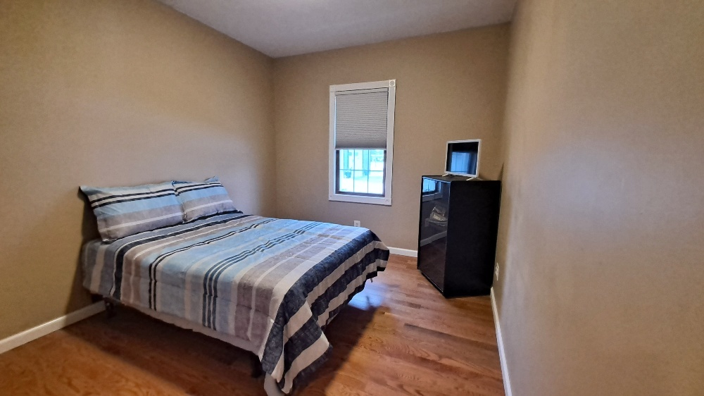 122 Portland Avenue Oglesby, IL 61348 - Photo 12 of 25 a bedroom with a bed and window
