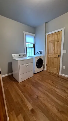 a view of a kitchen with a stove top oven