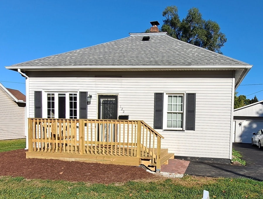 122 Portland Avenue Oglesby, IL 61348 - Photo 3 of 21 a front view of a house with a yard