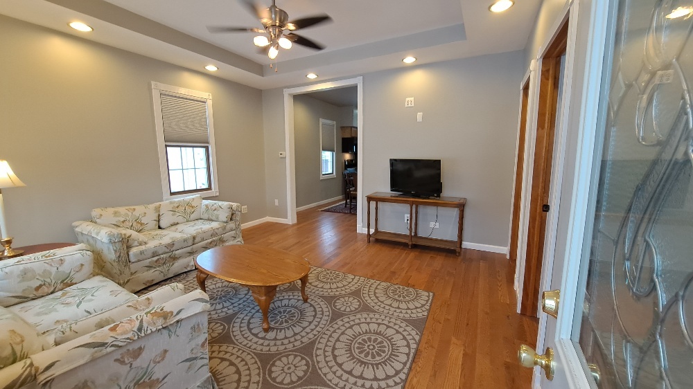 122 Portland Avenue Oglesby, IL 61348 - Photo 4 of 25 a living room with furniture and a flat screen tv