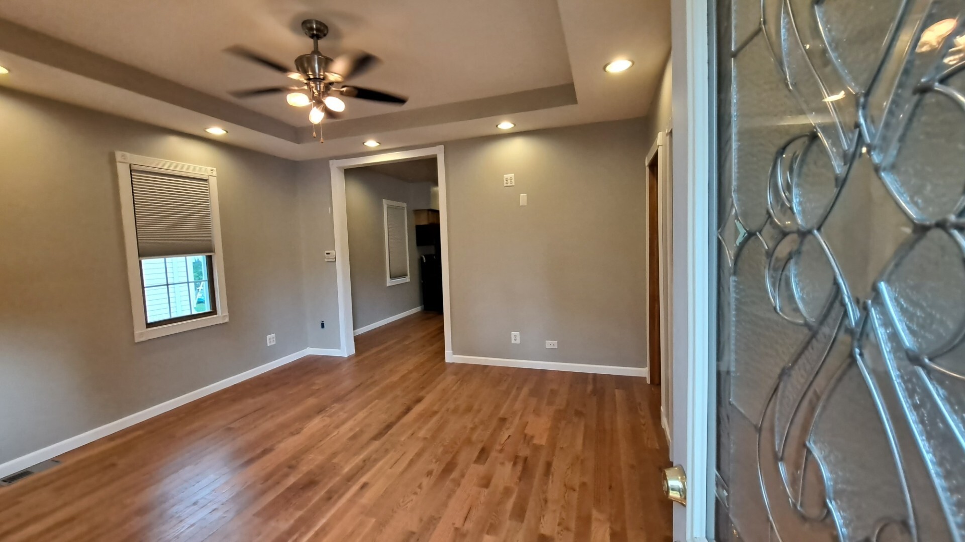 122 Portland Avenue Oglesby, IL 61348 - Photo 5 of 21 a view of an empty room with wooden floor and a window