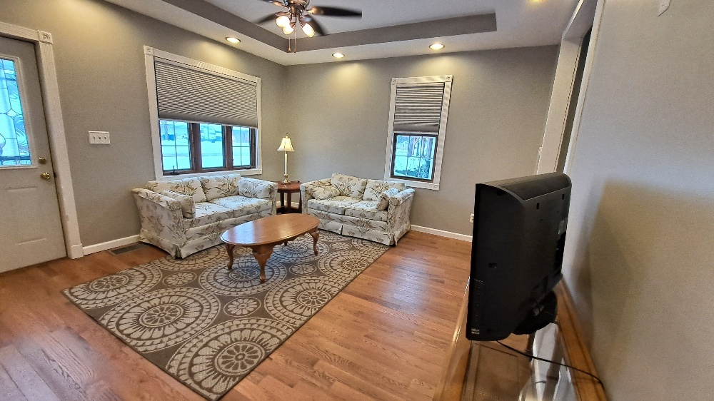 122 Portland Avenue Oglesby, IL 61348 - Photo 5 of 25 a living room with furniture and a rug