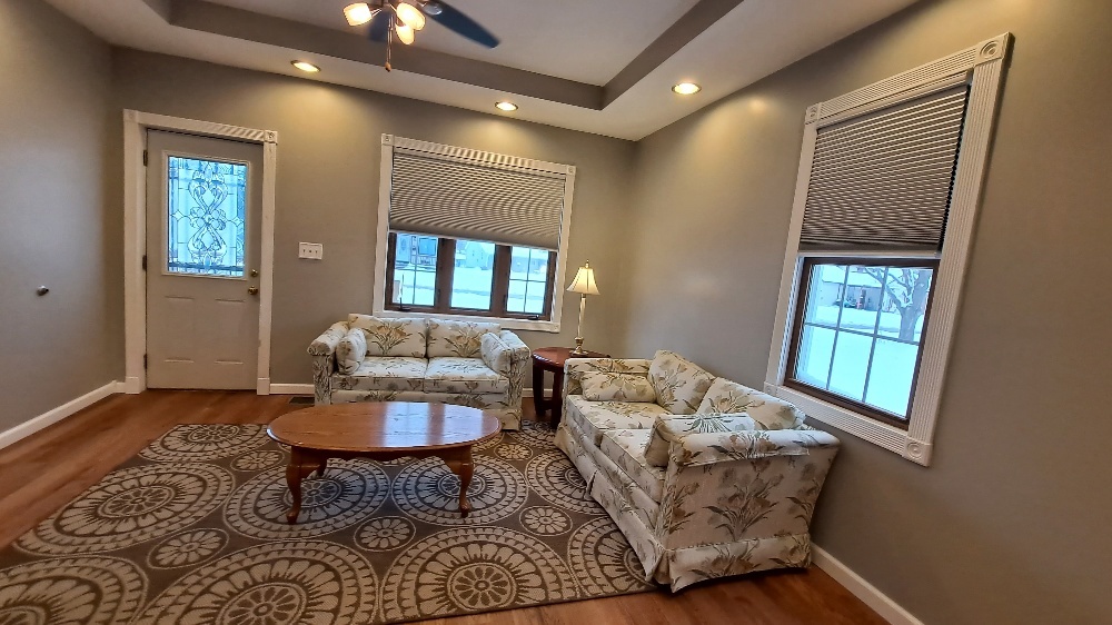 122 Portland Avenue Oglesby, IL 61348 - Photo 6 of 25 a living room with furniture and a window