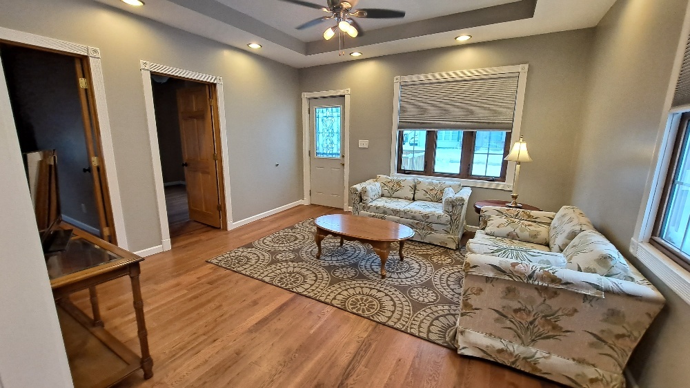 122 Portland Avenue Oglesby, IL 61348 - Photo 7 of 25 a living room with furniture and a window