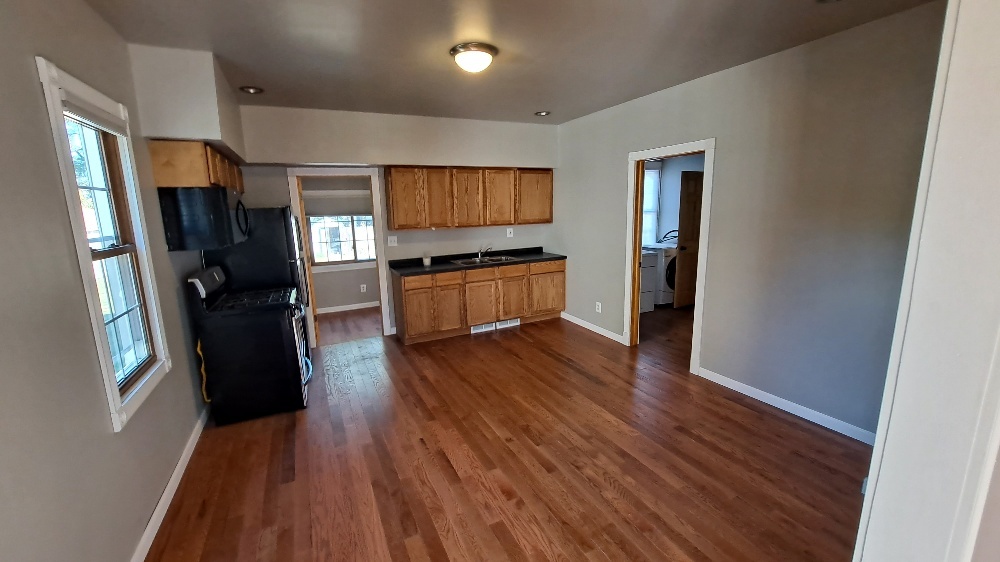 122 Portland Avenue Oglesby, IL 61348 - Photo 8 of 21 a kitchen with stainless steel appliances granite countertop a refrigerator stove and sink