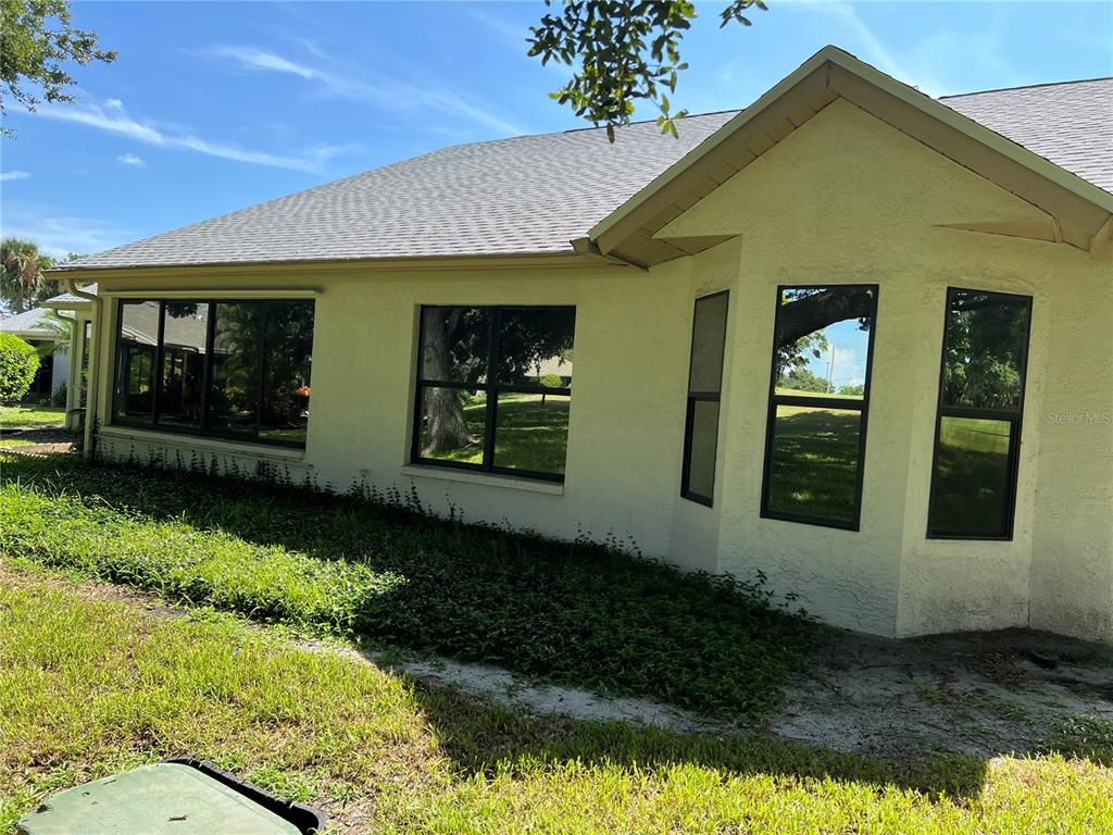 9108 Bassett Lane, Unit B New Port Richey, FL 34655 - Photo 36 of 66 a front view of a house with garden