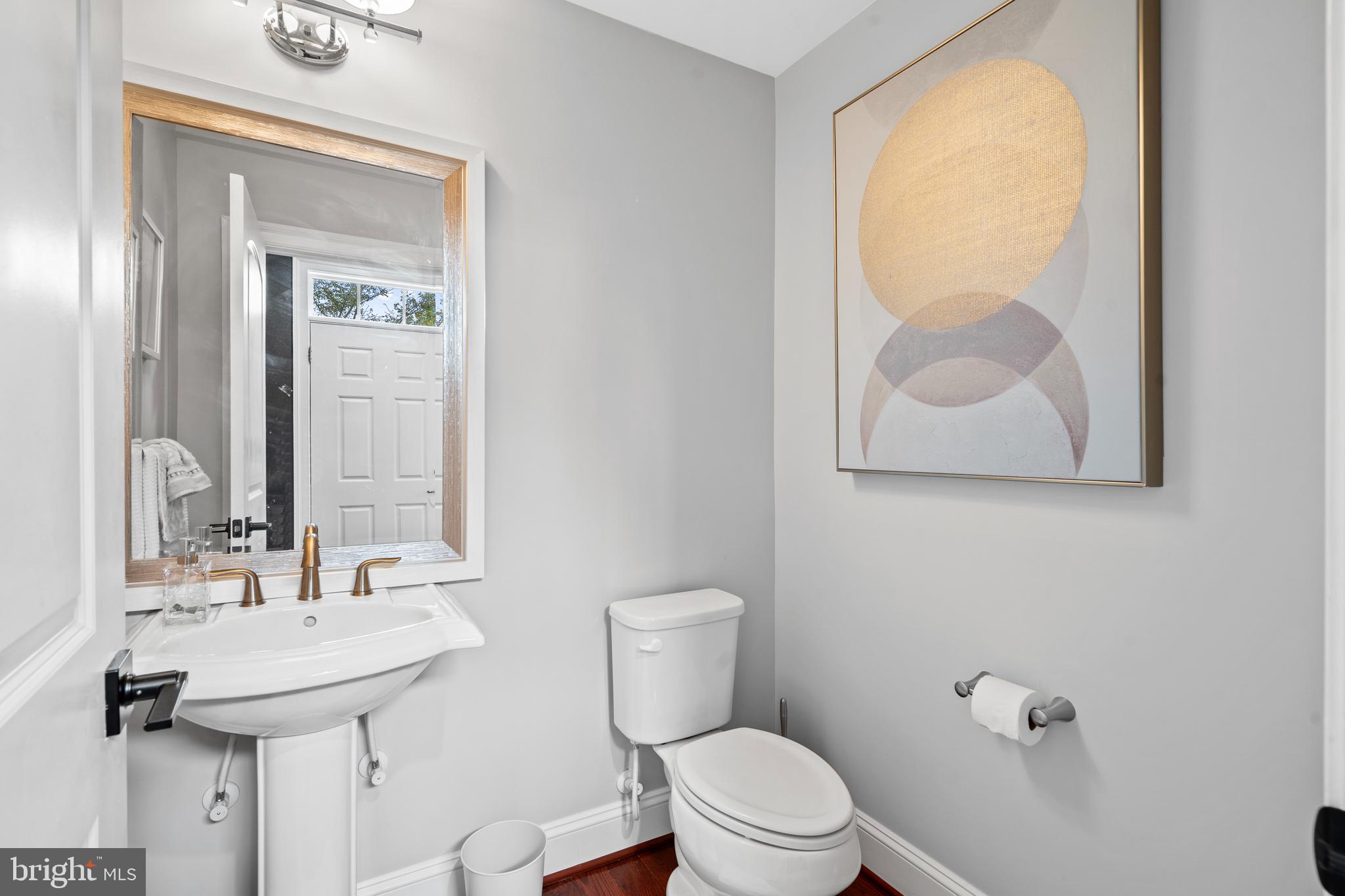 3822 Jacob Stout Road Doylestown, PA 18902 - Photo 11 of 39 a bathroom with a toilet sink and mirror