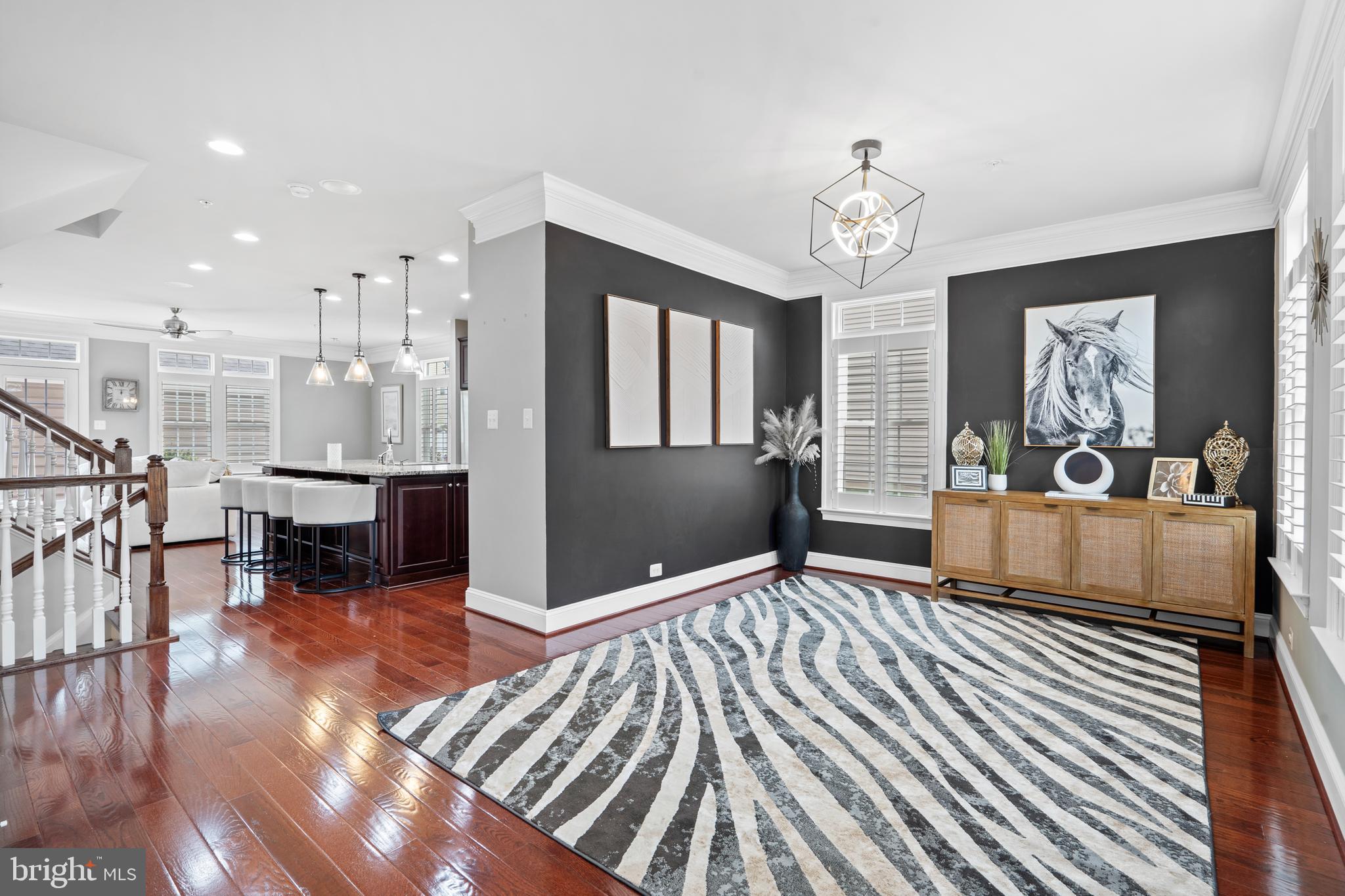 3822 Jacob Stout Road Doylestown, PA 18902 - Photo 12 of 39 a living room with furniture a dining table wooden floor and a chandelier