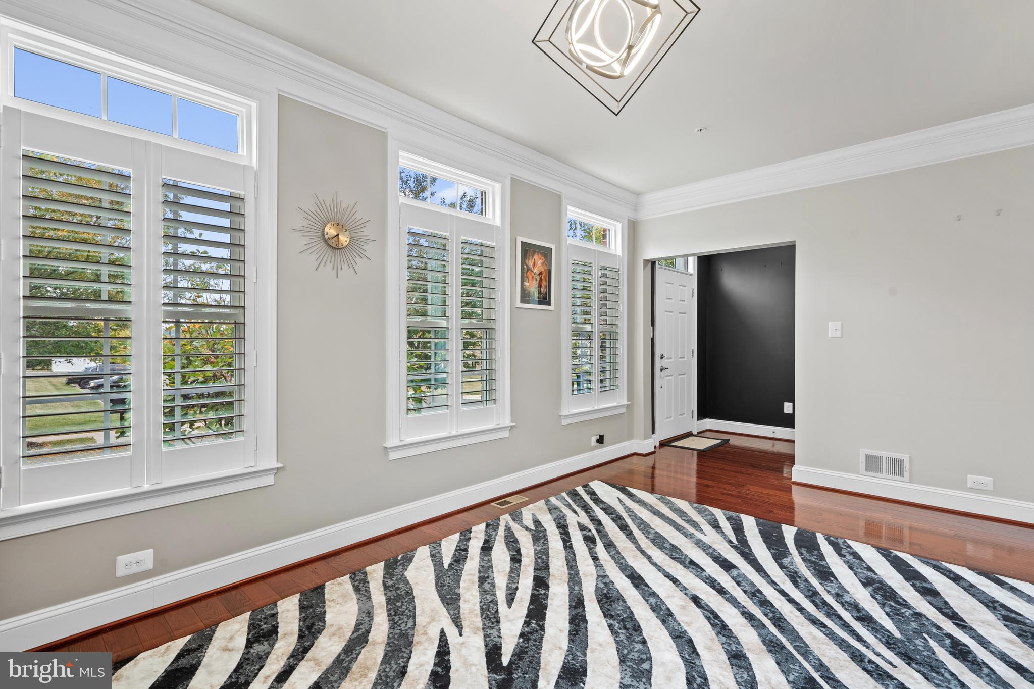 3822 Jacob Stout Road Doylestown, PA 18902 - Photo 13 of 39 a view of an empty room with a window and wooden floor