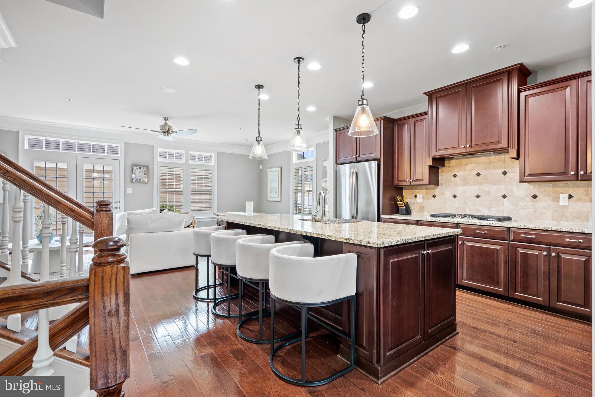 3822 Jacob Stout Road Doylestown, PA 18902 - Photo 14 of 39 a kitchen with granite countertop a table chairs stove a refrigerator and cabinets