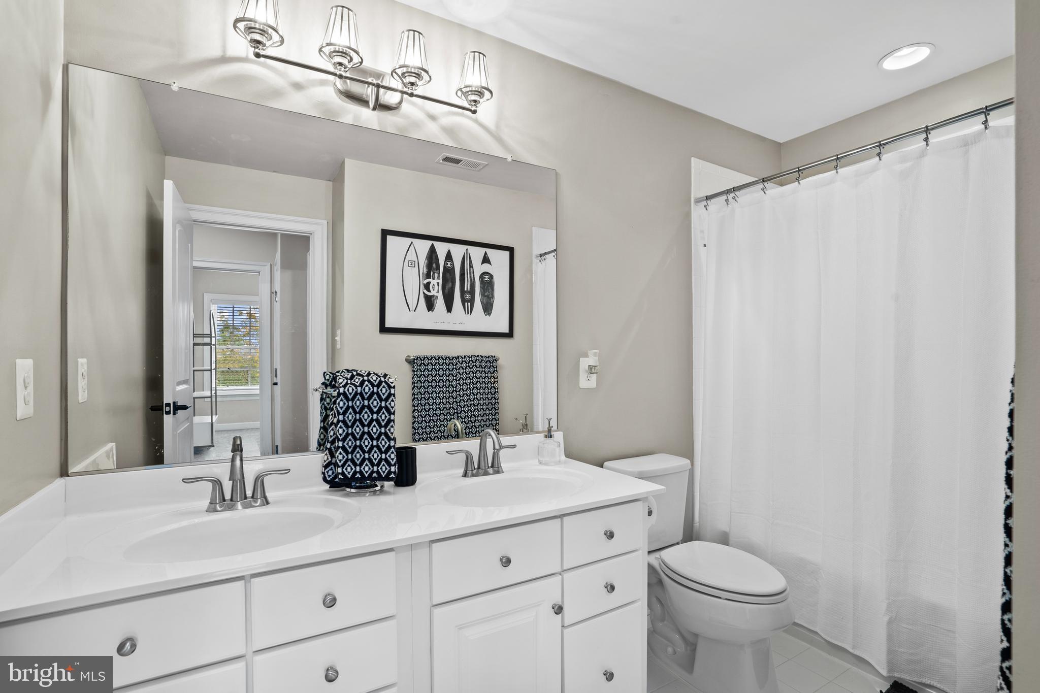 3822 Jacob Stout Road Doylestown, PA 18902 - Photo 23 of 39 a bathroom with a double vanity sink mirror and toilet