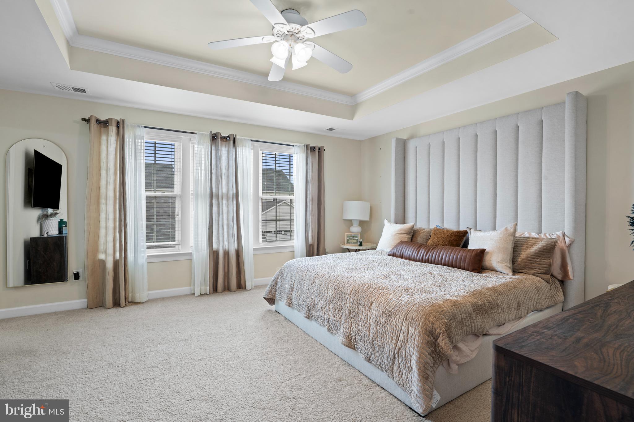 3822 Jacob Stout Road Doylestown, PA 18902 - Photo 25 of 39 a bedroom with a large bed and a chandelier