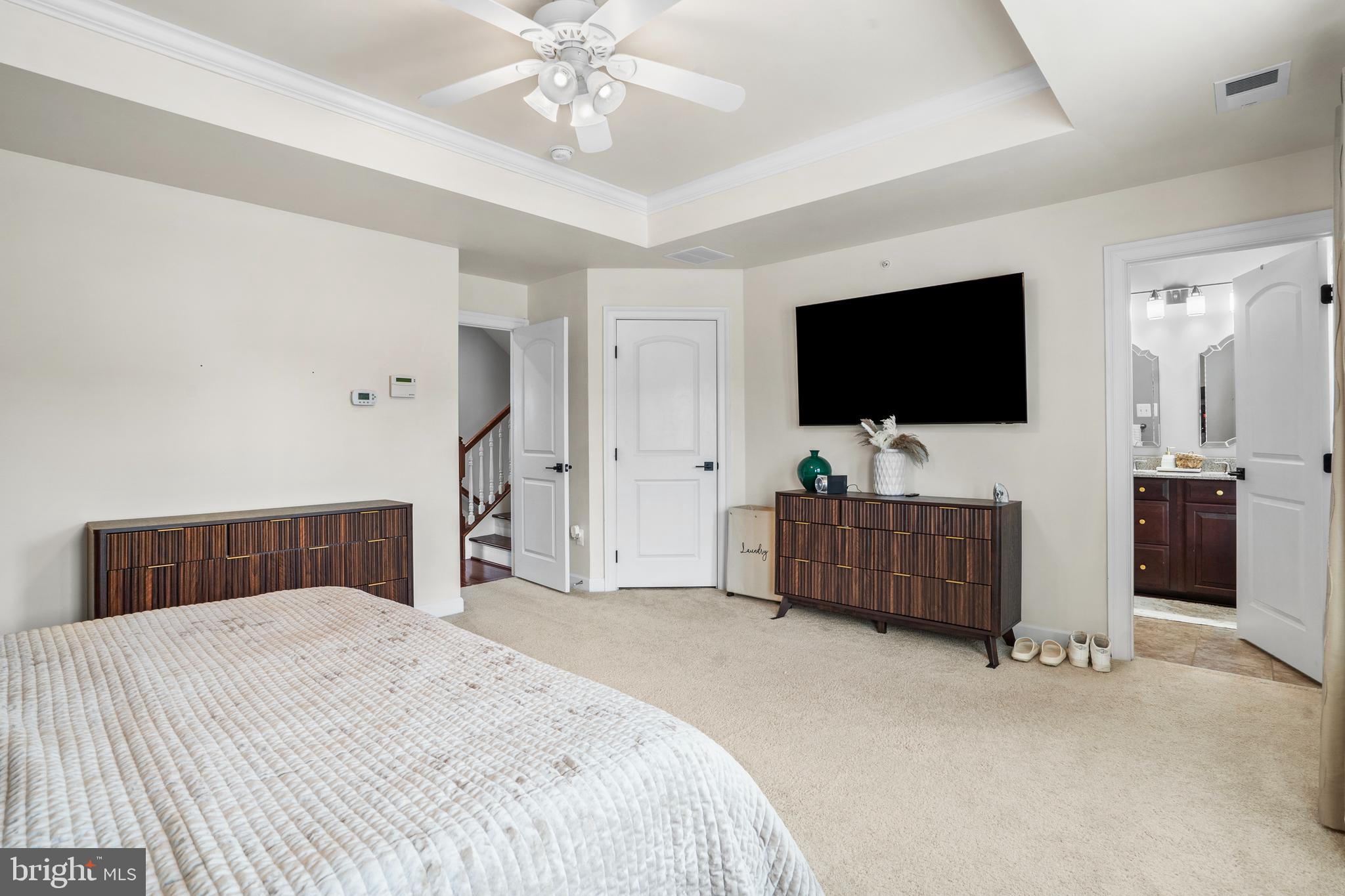 3822 Jacob Stout Road Doylestown, PA 18902 - Photo 26 of 39 a bedroom with a bed and a flat tv screen on wall