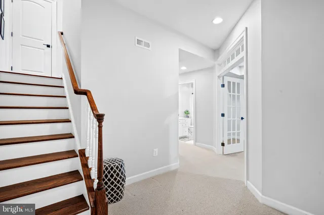 a view of entryway with wooden floor and stairs